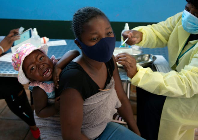 A baby cries as her mother receives the Pfizer vaccine against COVID-19, in the town of Diepsloot near Johannesburg, Thursday, October 21, 2021. A new COVID-19 variant has been detected in South Africa. which scientists say is a concern because of its high number of mutations and rapid spread among young people in Gauteng, the country's most populous province, Health Minister Joe Phaahla announced on Thursday , November 25, 2021.