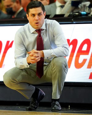 Wes Miller, head coach for the Cincinnati Bearcats, directs the team in the first half of a NCAA men's college basketball game against Monmouth Hawks, Saturday, November 27, 2021, at Fifth Third Arena in Cincinnati.