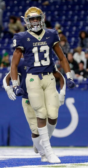 Cathedral's wide receiver Jaron Tibbs (13) celebrates after scoring a touchdown during the second half of a state final game Friday, Nov. 26, 2021, at Lucas Oil Stadium. The Cathedral Fighting Irish defeated the Zionsville Eagles 34-14.