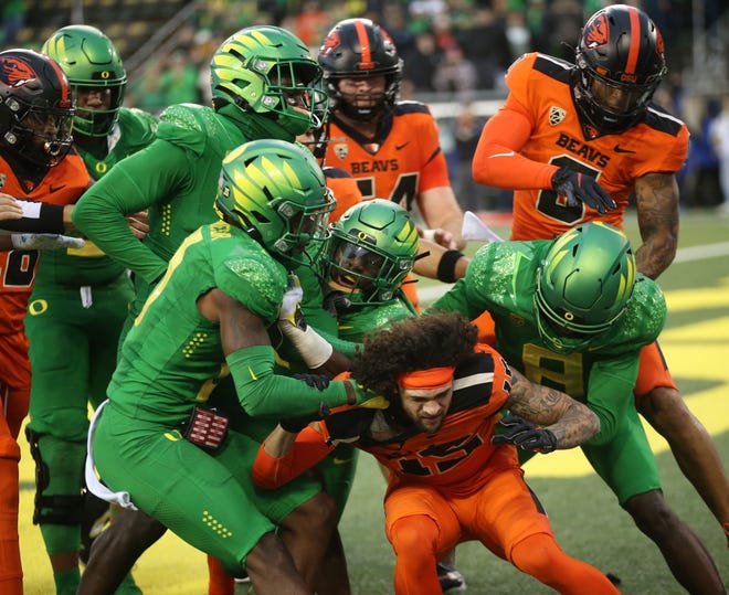 A fight breaks out on the goal line between Oregon and Oregon State players after the Beaver fourth quarter touchdown.