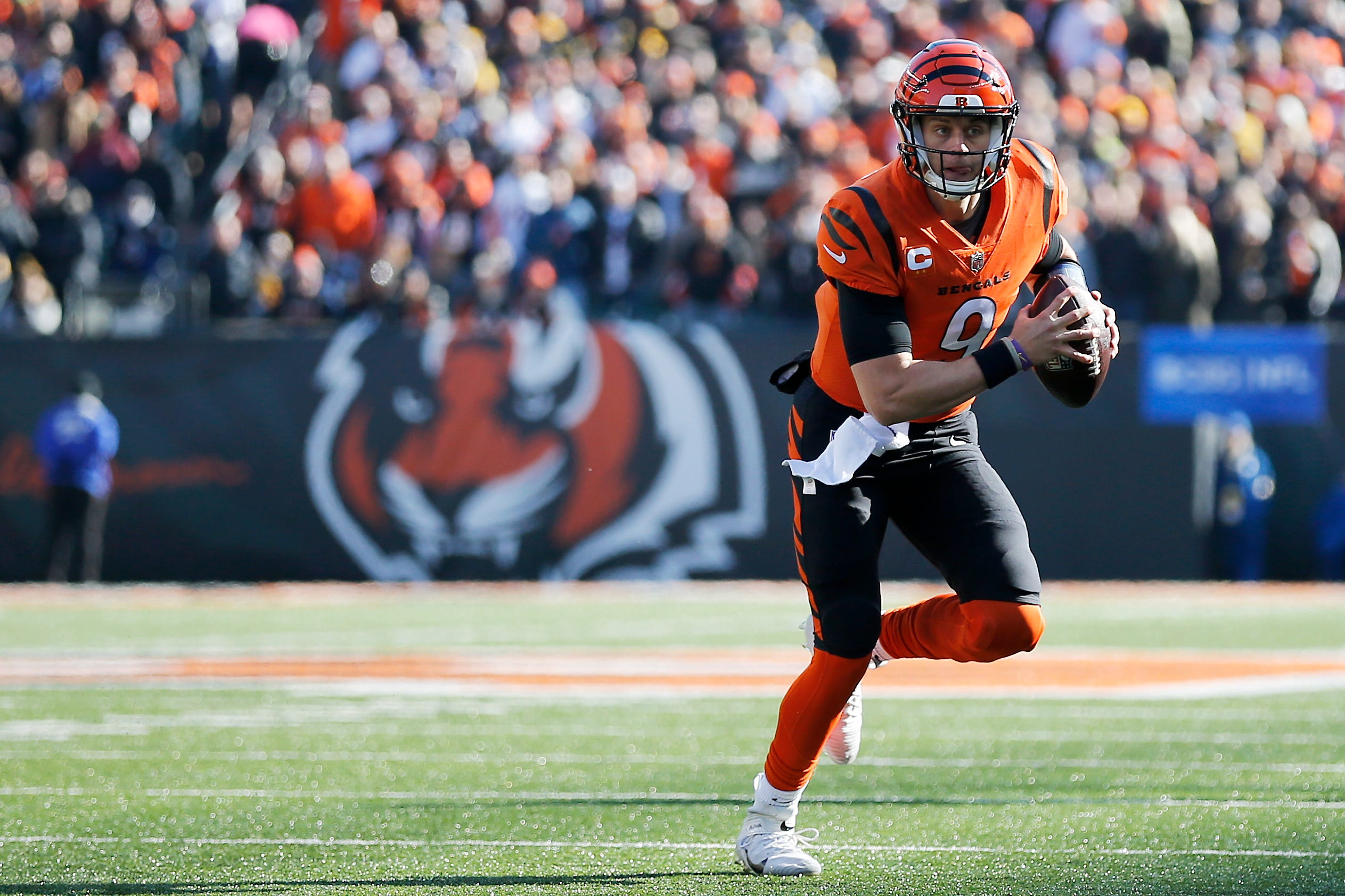 Cincinnati Bengals quarterback Joe Burrow (9) scrambles out of the pocket in the first quarter of the NFL Week 12 game between the Cincinnati Bengals and the Pittsburgh Steelers at Paul Brown Stadium in downtown Cincinnati on Sunday, Nov. 28, 2021.