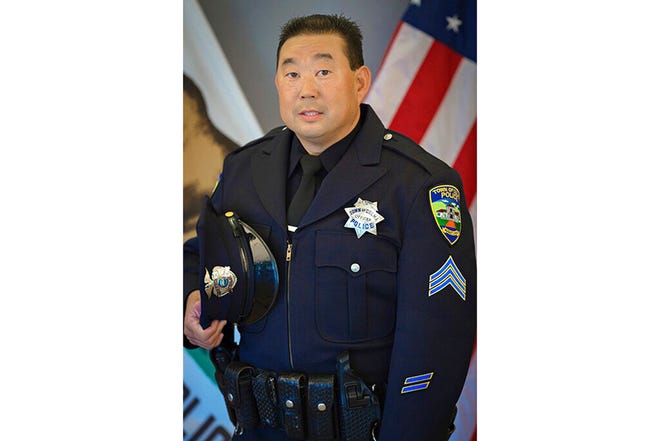 This undated photo provided by the Town of Colma Police Department, in California, shows former Officer Kevin Nishita. Nishita, a retired police officer and armed guard who provided security for many reporters in the region, was shot in the abdomen during an attempted robbery of KRON-TV's camera equipment in Oakland, Calif., on Wednesday, Nov. 24, 2021. The news crew was covering a recent smash-and-grab robbery of a clothing store. Parts of California have been struck by a rash of organized retail thefts in which bands of thieves break into high-end stores and snatch merchandise. (Brandon Vaccaro/Colma Police Department via AP)