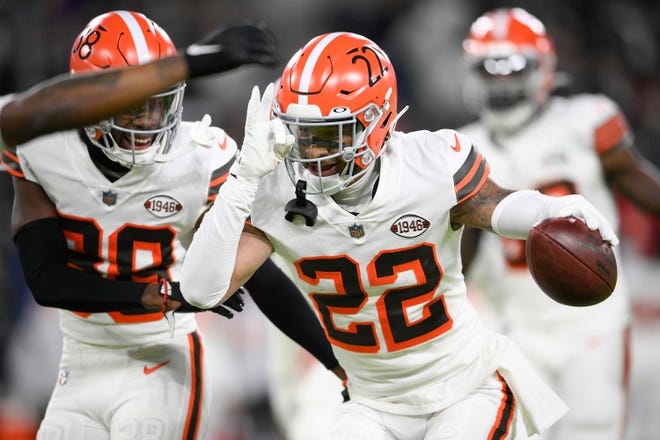 Cleveland Browns defensive back Grant Delpit (22) reacts with cornerback A.J. Green (38) after intercepting a pass from Baltimore Ravens quarterback Lamar Jackson during the first half of an NFL football game, Sunday, Nov. 28, 2021, in Baltimore. (AP Photo/Nick Wass)