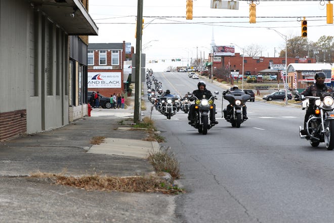 The 35th annual Gaston County Toys for Tots motorcycle ride roars down Franklin Boulevard on Sunday, Nov. 28, 2021.