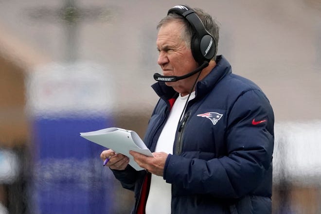 New England Patriots head coach Bill Belichick reviews plays during the Patriots' 36-13 win against the Tennessee Titans on Sunday in Foxxborough, Mass.