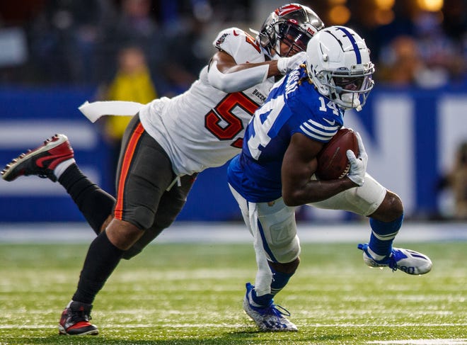 Indianapolis Colts wide receiver Zach Pascal (14) slips a tackle by Tampa Bay Buccaneers inside linebacker Kevin Minter (51) on Sunday, Nov. 28, 2021.