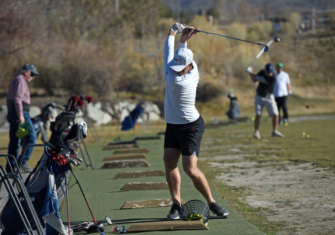 Nice late-autumn weather brought David Rumbaugh out to the driving range at Red Hawk on Monday. A high of 65 degrees was forecast for Monday, a near-record high for this time of year in the Reno area.