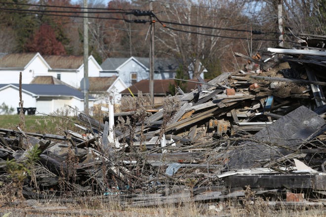 Houses in the North Linden Avenue neighborhood can be seen beyond a pile of debris on the former Lear property. Mayor Don Mason said the project has been a priority his administration for the last 23 months. The city took possession of the property last summer, purchasing it from the Muskingum County Land Bank for $28,000.