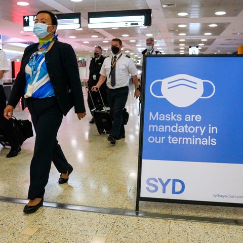 A flight crew walk through the terminal at Sydney 