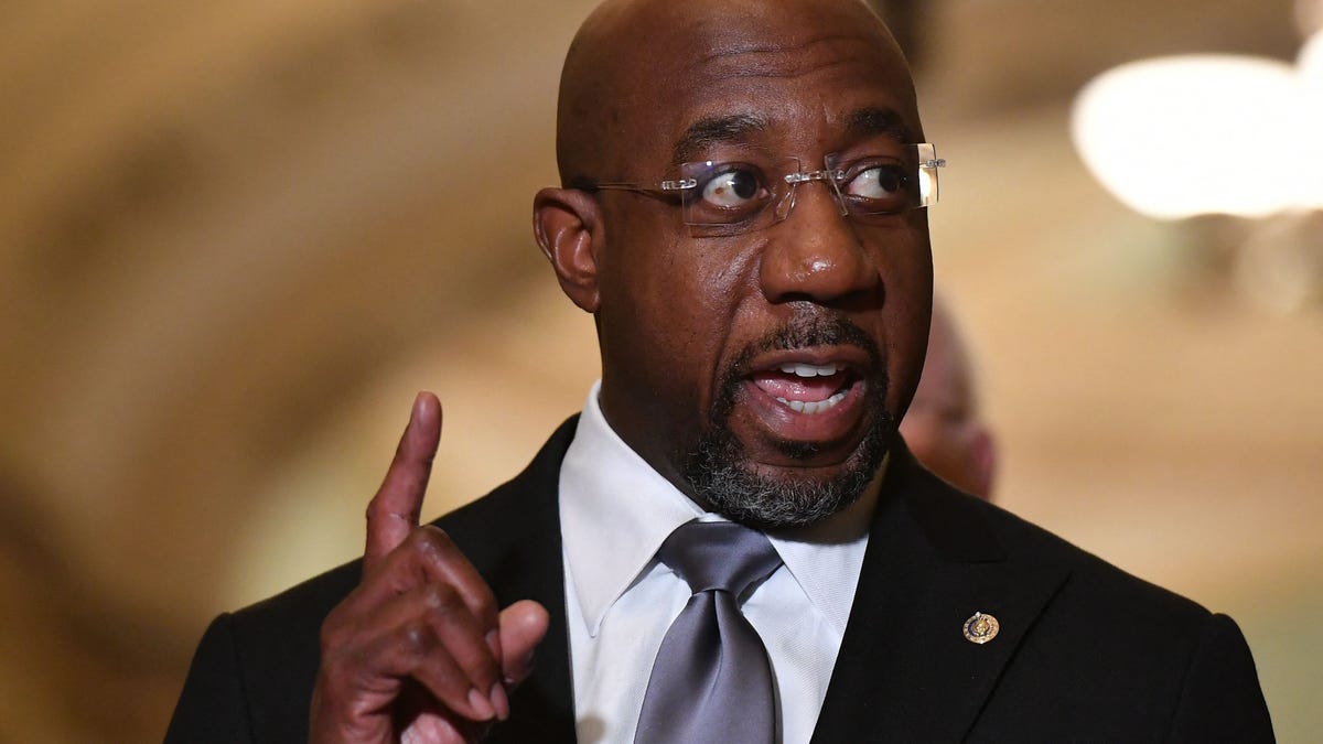 US Democratic Senator Raphael Warnock speaks during a press conference following the Democrats Policy Luncheon at the US Capitol building on November 2, 2021 in Washington, DC. (Photo by MANDEL NGAN / AFP) (Photo by MANDEL NGAN/AFP via Getty Images) ORG XMIT: 0 ORIG FILE ID: AFP_9QW26H.jpg