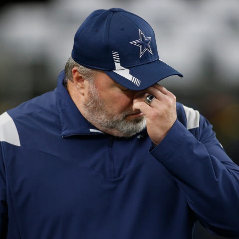 Dallas Cowboys head coach Mike McCarthy walks on t