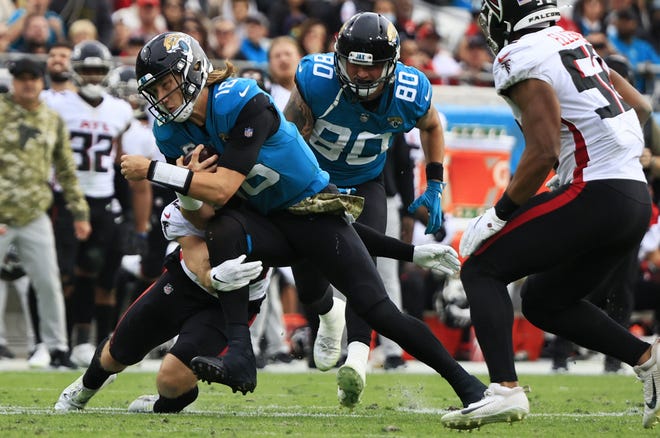 Jaguars quarterback Trevor Lawrence carries the ball against Atlanta last week. With the Jaguars adding new wrinkles to their offense, Lawrence carried the ball five times for 39 yards.