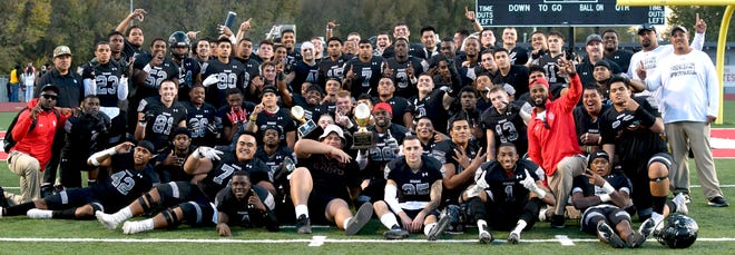 Members of the New Mexico Military Institute Broncos football team pose for a picture. The Roswell school hosts Northwest Mississippi College Dec. 5, 2021 in the NJCAA playoffs.