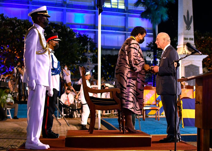 Charles, Prince of Wales, receives the Order of Freedom of Barbados from President of Barbados Dame Sandra Mason during the ceremony to declare Barbados a Republic and the Inauguration of the President of Barbados at Heroes Square in Bridgetown, Barbados, on Nov. 30, 2021.