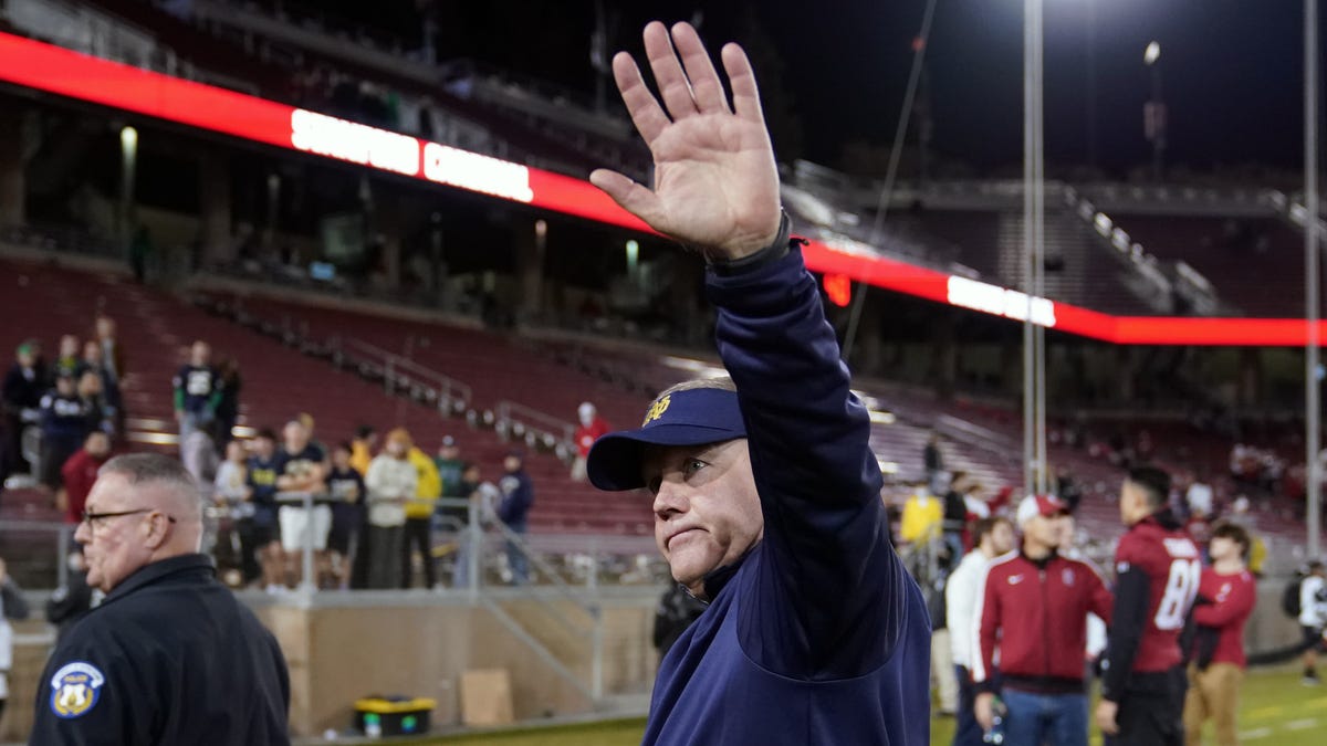 Brian Kelly walks off the field after Notre Dame's win against Stanford.