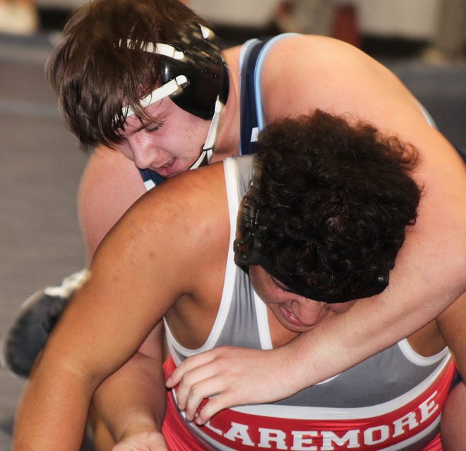 Bartlesville High's Adyn Peugh, left, takes control during a wrestling match earlier this season.