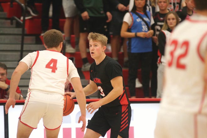 ADM's Ryan Conrad looks to go around a DCG player during a game on Tuesday, Nov. 30, 2021, in Grimes.