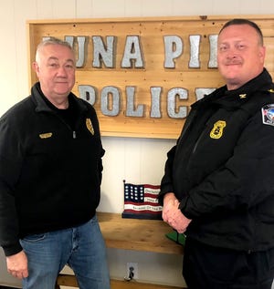 John Poe (right), a police officer with 30 years of law enforcement experience in River Rouge and Detroit, takes over as police chief for the City of Luna Pier, succeeding the retiring Brett Ansel.