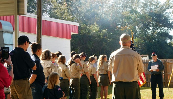 A Veterans of Foreign Wars Post 4833 member addresses attendees and members of Scout Troop 451 of Pace during a flag retirement ceremony Nov. 21 in Milton.