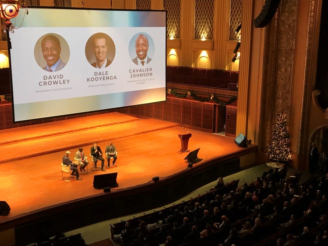 State Sen. Dale Kooyenga along with Milwaukee County Executive David Crowley, Milwaukee Common Council President Cavalier Johnson speak at a panel emceed by  Tim Sheehy, president of the Metropolitan Milwaukee Association of Commerce, at the Bradley Symphony Center in Milwaukee Tuesday.