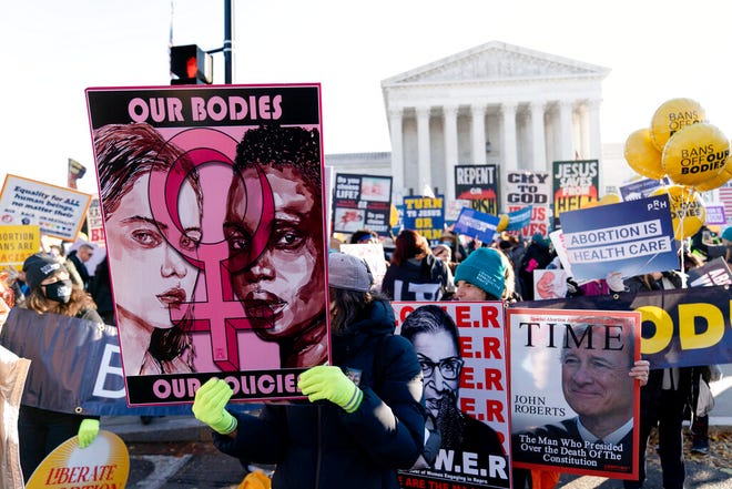 Abortion rights advocates demonstrate in front of the U.S. Supreme Court Wednesday, Dec. 1, 2021, in Washington, as the court hears arguments in a case from Mississippi, where a 2018 law would ban abortions after 15 weeks of pregnancy, well before viability. (AP Photo/Jose Luis Magana)