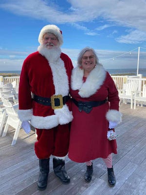 Paul Evalds and wife Debra Evalds play Santa and Mrs. Clause in and around Lewes.
