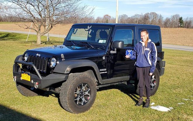 Midlakes junior Katelyn Wilkes has a new Jeep to go with her cross country championship.