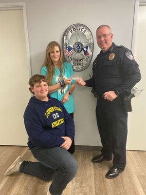 Bobbie and Cameron Stone made a donation for Shop with a Cop in loving memory of Bobbie’s mother Debbie Kitchens. Here they are presenting their donation to Stephenville Police Chief Dan Harris.