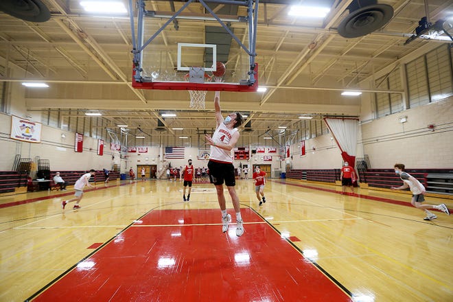 Hingham High senior Nick Johannes goes up for a layup during a fast break drill during basketball tryouts at Hingham High School on Wednesday, Dec. 1, 2021.