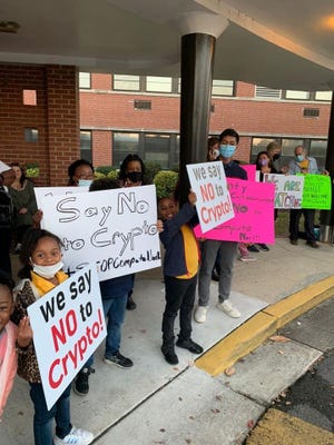 The Belvoir, NC community rallies against a proposed cryptocurrency mining farm in October 2021.