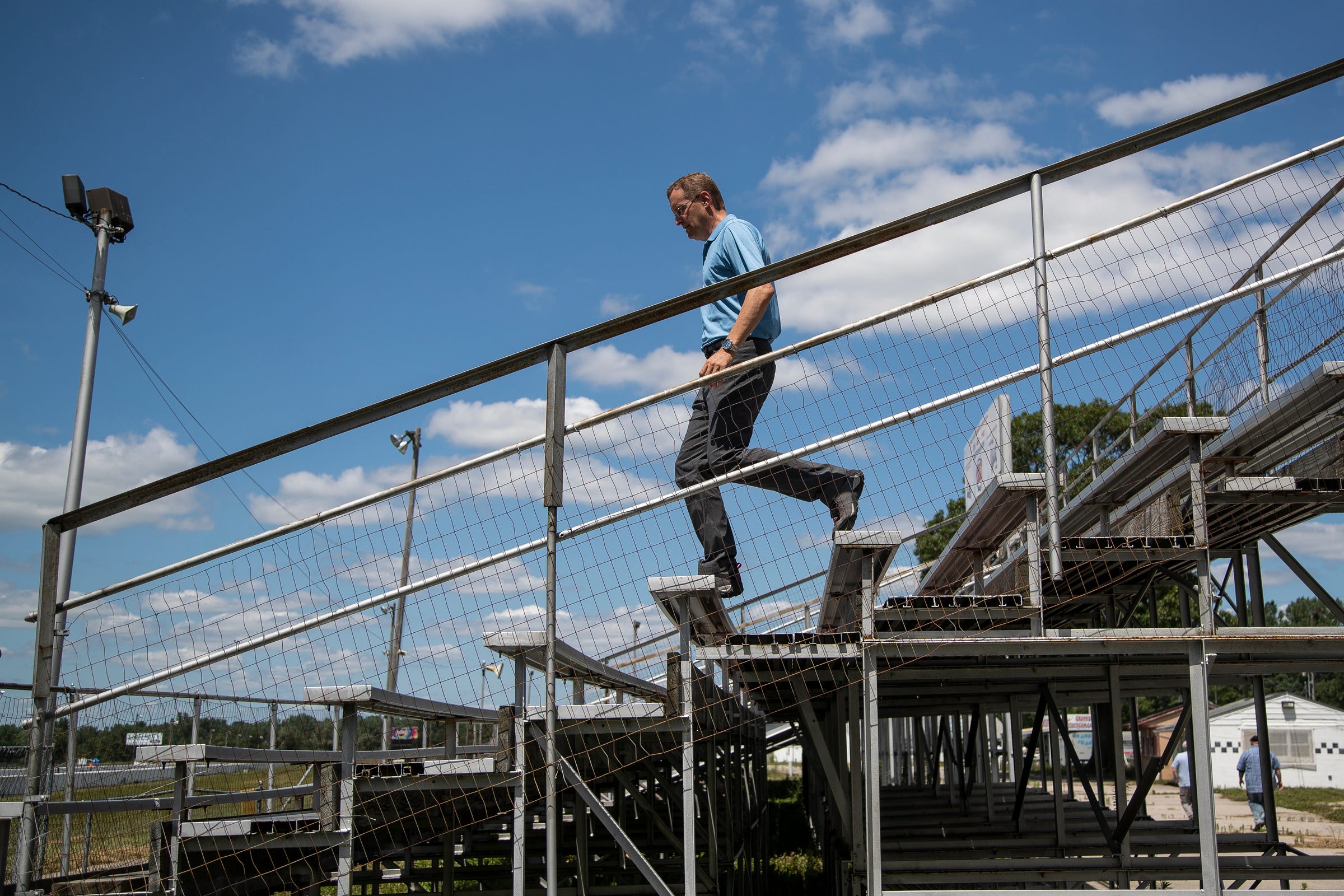 David Ploucha, a potential buyer, walks down the bleachers at Milan Dragway in London Township in July 2021.