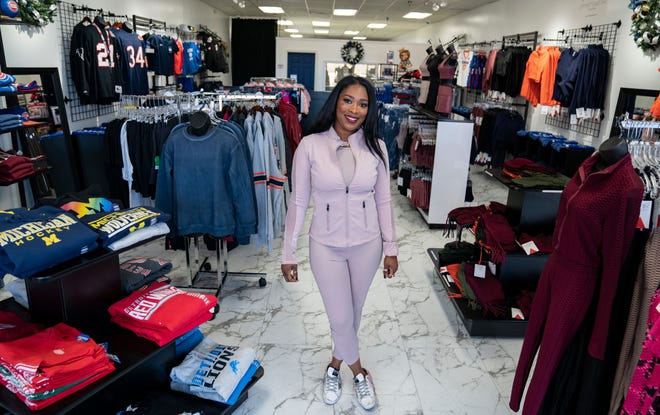 Michaelyn Roberson, president and founder of Empire Sports, works in her sports apparel shop in Oak Park on Nov. 22, 2021.