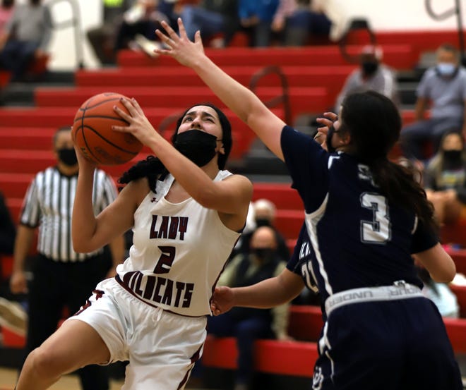 Senior Brianna Flores scored on this play to push the Deming Lady Wildcats to victory on Tuesday over the visiting Silver High Fighting Colts 36-33.