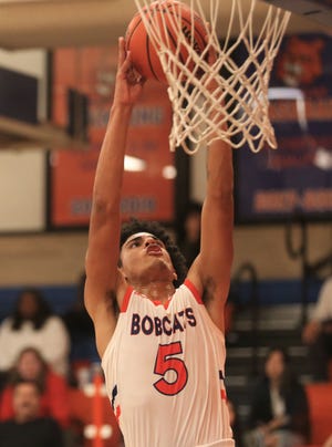 San Angelo Central High School's Branden Campbell goes up for a dunk during a game against El Paso Ysleta at the Doug McCutchen Memorial Basketball Tournament at Babe Didrikson gym on Thursday, Dec. 2, 2021.