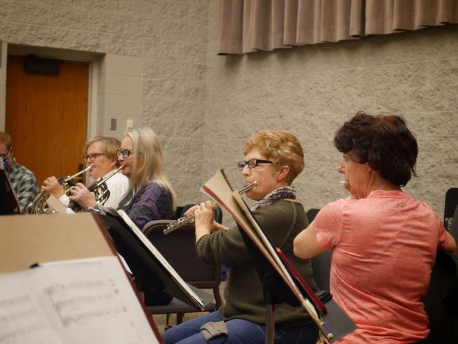 Susan Bjorstrom, Terri Deming, Kris Boyle and Besy Eickhoff practice with the Amadeus Chamber Symphony.