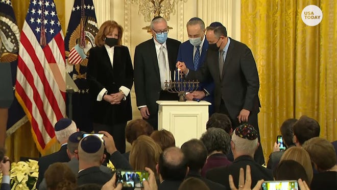White House celebrates Hanukkah with menorah-lighting ceremony and Doug Emhoff lit it as the first Jewish spouse in history of a president or vice president.