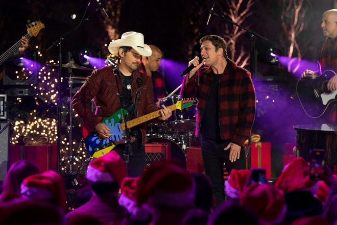 (LR) Brad Paisley and Rob Thomas performing during "Christmas at Rockefeller Center."