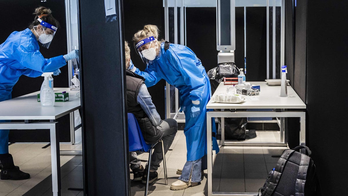 Travelers from South Africa are tested for COVID-19 at the airport in Amsterdam on Nov. 30, 2021. While South Africa first alerted global authorities to the omicron variant, Dutch health officials said on Nov. 30 that they have found two omicron cases from before the alarm was raised, indicating the new variant was already spreading in parts of Europe.
