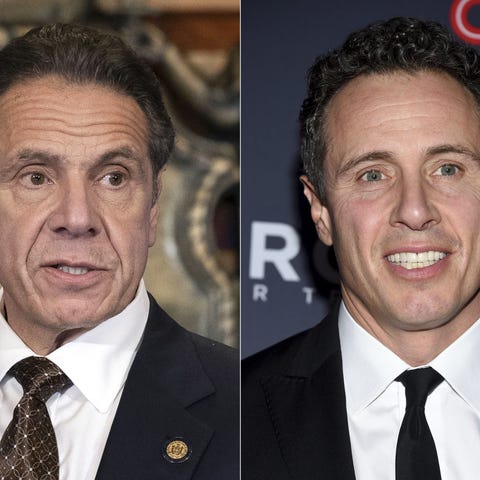 New York Gov. Andrew Cuomo, left, appears during a