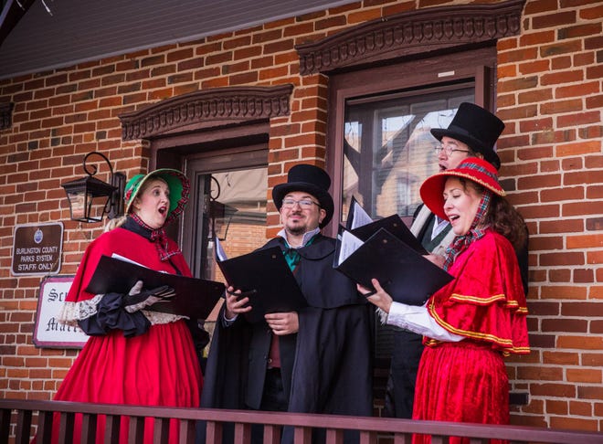 Carolers at singing holiday favorites at the Victorian Holiday Celebration at Smithville Park.