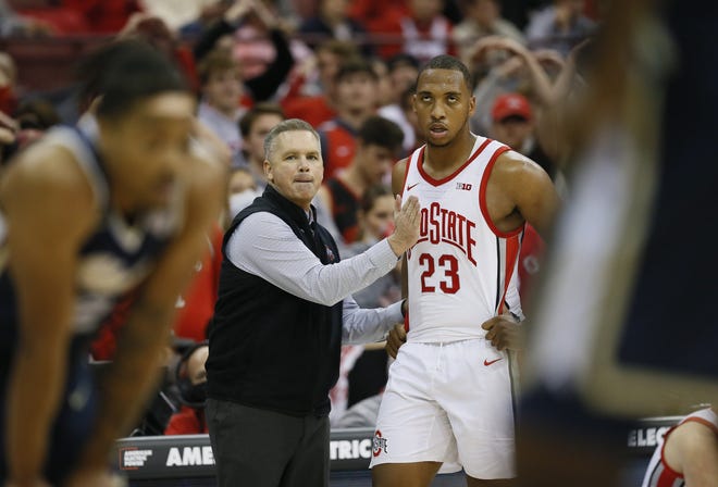 Ohio State Buckeyes head coach Chris Holtmann encourages forward Zed Key (23) during the second half of the NCAA men's basketball game against the Akron Zips at Value City Arena in Columbus on Tuesday, Nov. 9, 2021. The Buckeyes won 67-66.