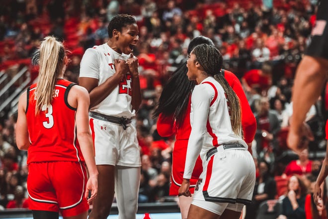 Texas Tech's Khadija Faye (23) and Taylah Thomas celebrate a bucket against Georgia on Thursday, Dec. 2, 2021, at United Supermarkets Arena in Lubbock.