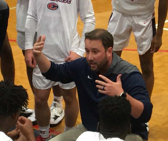 Effingham County High School boys basketball coach Jake Darling talks to his team during a recent scrimmage against The Habersham School. Darling, who also coached at South Effingham, knows both sides of the Rebels’ 28-game winning streak against the Mustangs.