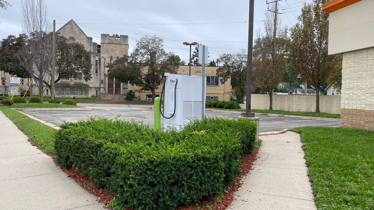 Electric vehicle chargers are frequently in empty lots behind businesses