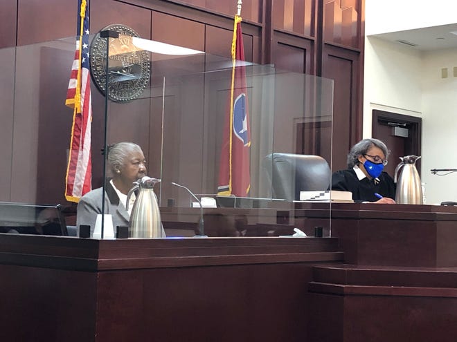 Joyce Watkins, left, takes the stand in her own defense before Judge Angelita Blackshear Dalton. Watkins and Charles Dunn, now deceased, were convicted in a 1987 child rape and murder. New evidence shows they were innocent, defense and prosecutors agree. The case was reopened in November 2021.