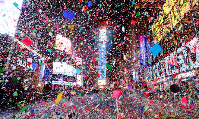 Confetti rained down on an empty Times Square in Manhattan after the ball dropped, marking the start of the New Year January 1, 2021.