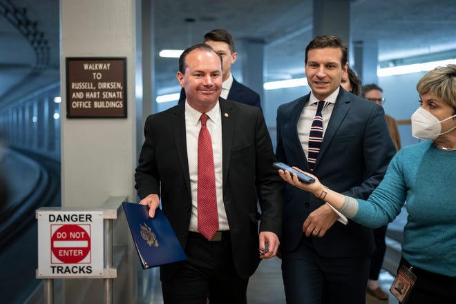 Sen. Mike Lee, R-Utah, ignores questions from reporters on his way to a vote at the U.S. Capitol on Thursday in Washington, D.C.