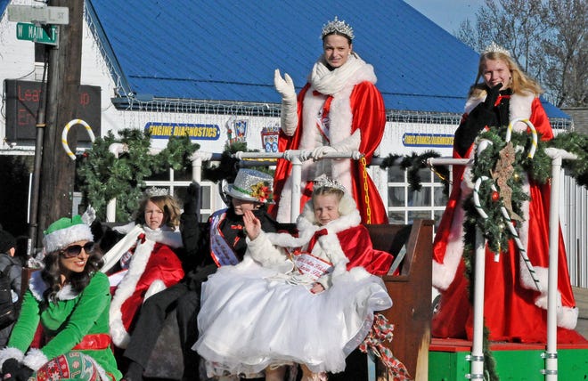 Dalton Holidays Festival Queen Emma Jarvis and Princess Abby Jones ride the royal Saturday during the festival's parade.