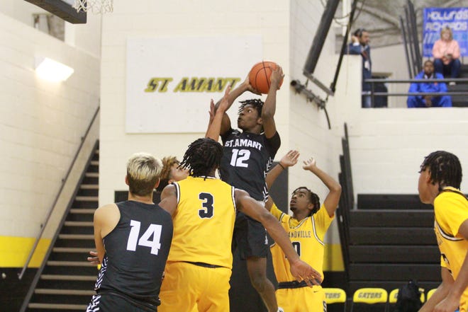 St. Amant’s Colby Ester goes up for a contested shot during the Gators’ 65-51 loss to Scotlandville.