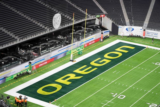 A detailed view of the Oregon Ducks logo in the end zone at Allegiant Stadium before the Pac-12 Championship Game between Oregon and the Utah Utes.
